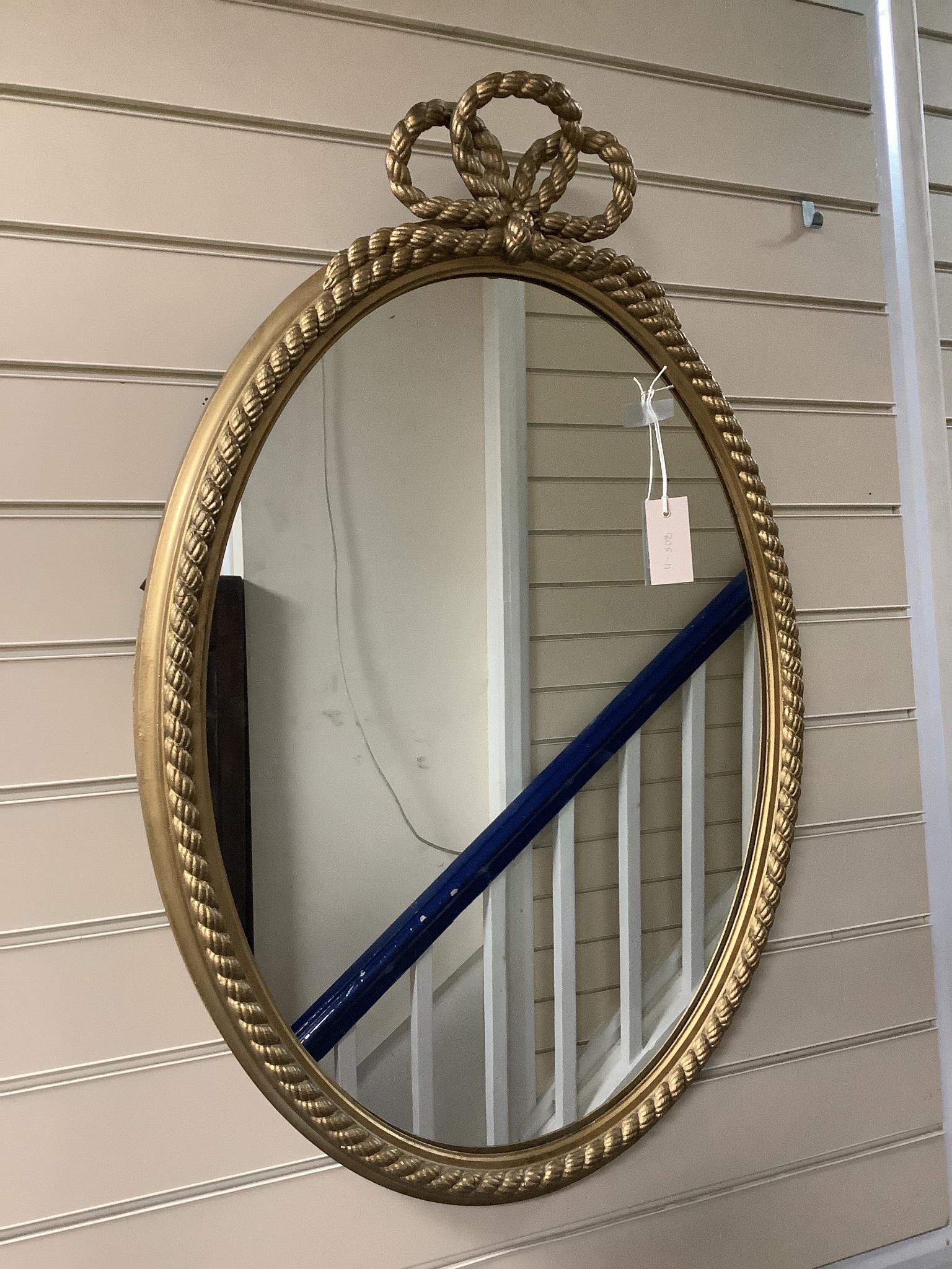 A gilt and composite wall mirror with simulated rope twist frame, width 56cm, height 84cm